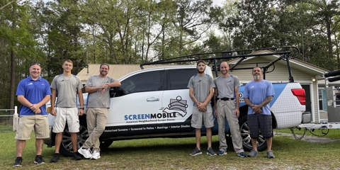 Screenmobile of Destin team in front of their truck