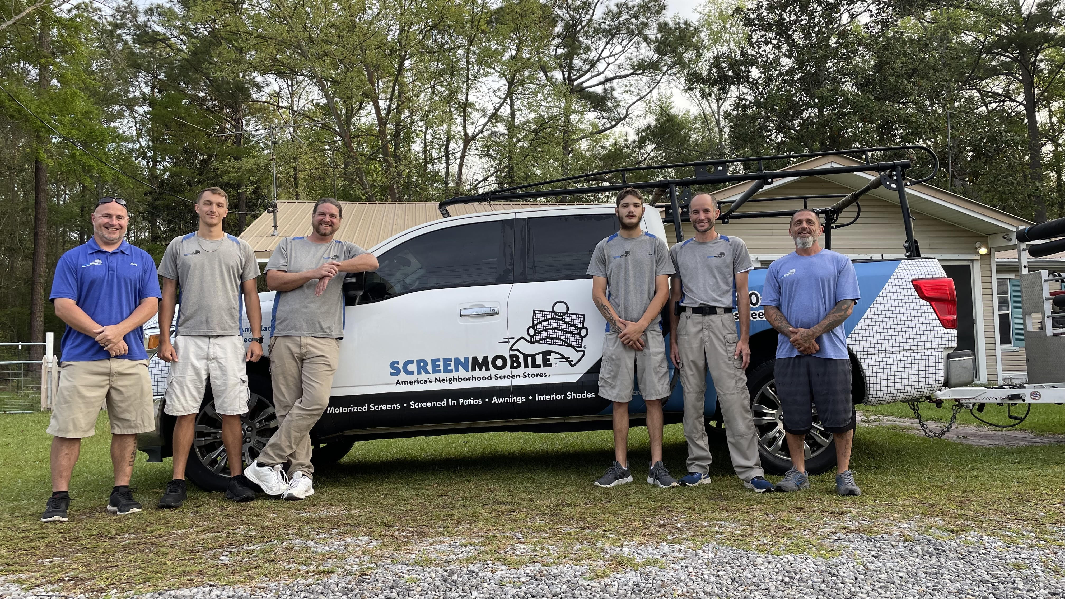 Screenmobile of Destin team in front of their truck